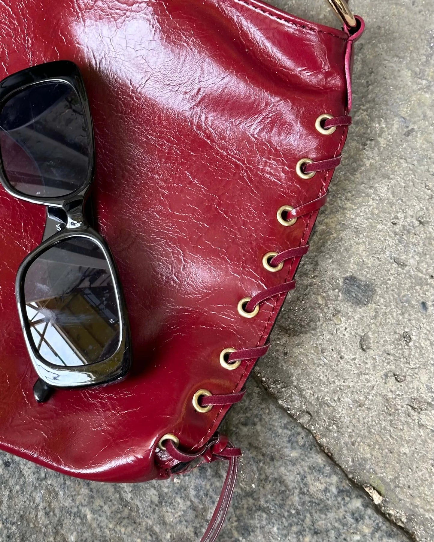RANCES CLARET RED ARM BAG WITH ROPE DETAIL
